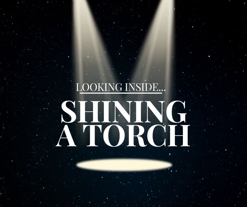 Shining a torch on the inside shining a torch symbol to look inside the mind